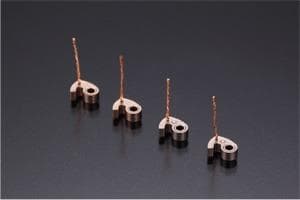 Comma-shaped carbon brush