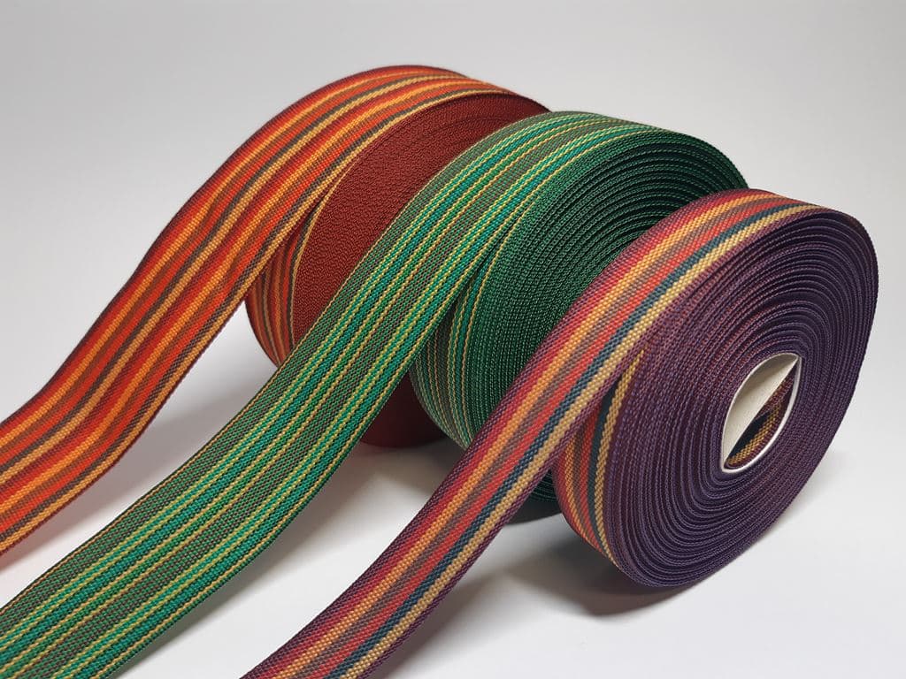 Loom-woven striped stripes made of polyester and lamé-polyester blend