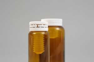Glass bottles and desiccant closures